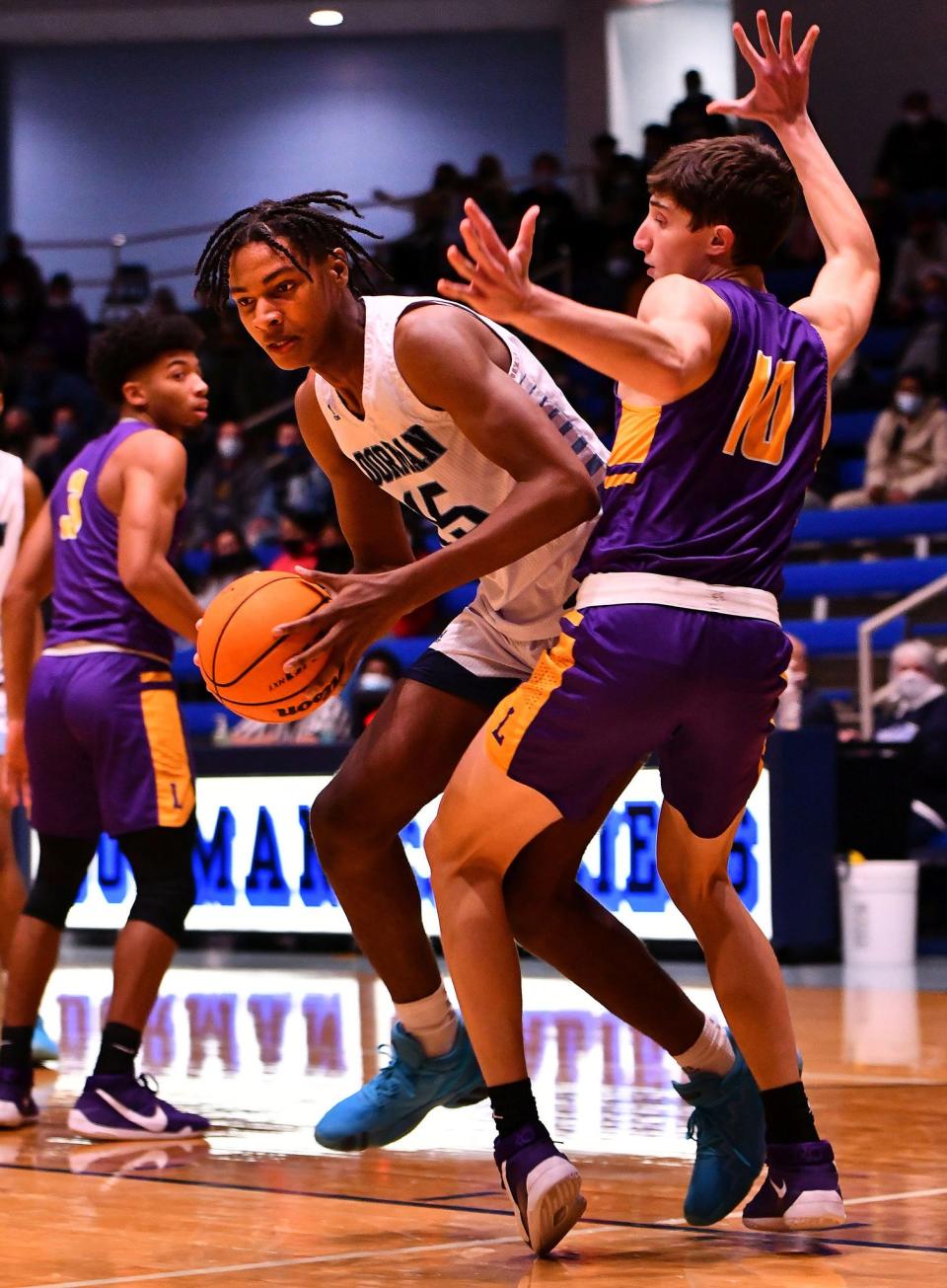 The Dorman Cavaliers take on Legacy Early College during basketball action at Dorman High School in Spartanburg, Wednesday evening, December 2, 2020. Dorman's Noah Clowney (15) drives to the basket against defense from Legacy Early College's Kidd Brizek (10).