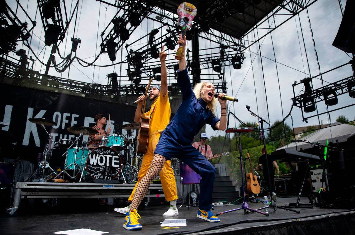 Sarah Blackwood, lead singer of Walk Off the Earth thrusts her ukulele into the air as they open for Lindsey Stirling Tuesday night, Aug. 9, 2023 in Raleigh.