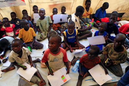 Unaccompanied minors who fled civil war in South Sudan draw during a vist of United Nations Secretary General at Imvepi settlement camp in northern Uganda Antonio Guterres June 22, 2017. REUTERS/James Akena