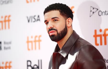 FILE PHOTO: Rapper Drake arrives on the red carpet for the film "The Carter Effect" at the Toronto International Film Festival (TIFF), in Toronto, Canada, September 9, 2017. REUTERS/Mark Blinch