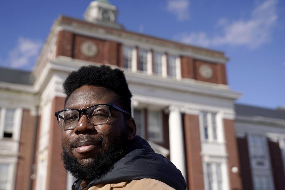 Somerville City Councilor Willie Burnley Jr., stands near City Hall, in Somerville, Mass, Wednesday, Feb. 1, 2023. Somerville could follow the lead of an increasing number of municipal, county and state governments and use federal pandemic relief funds to pay residents' burdensome medical debt. (AP Photo/Steven Senne)