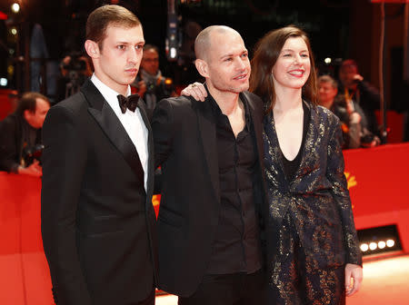 Tom Mercier, Director Nadav Lapid and Louise Chevillotte arrive for the awards ceremony of the 69th Berlinale International Film Festival in Berlin, Germany, February 16, 2019. REUTERS/Fabrizio Bensch