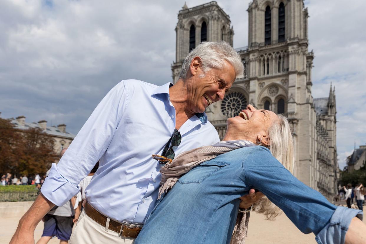 senior couple having fun visiting a city