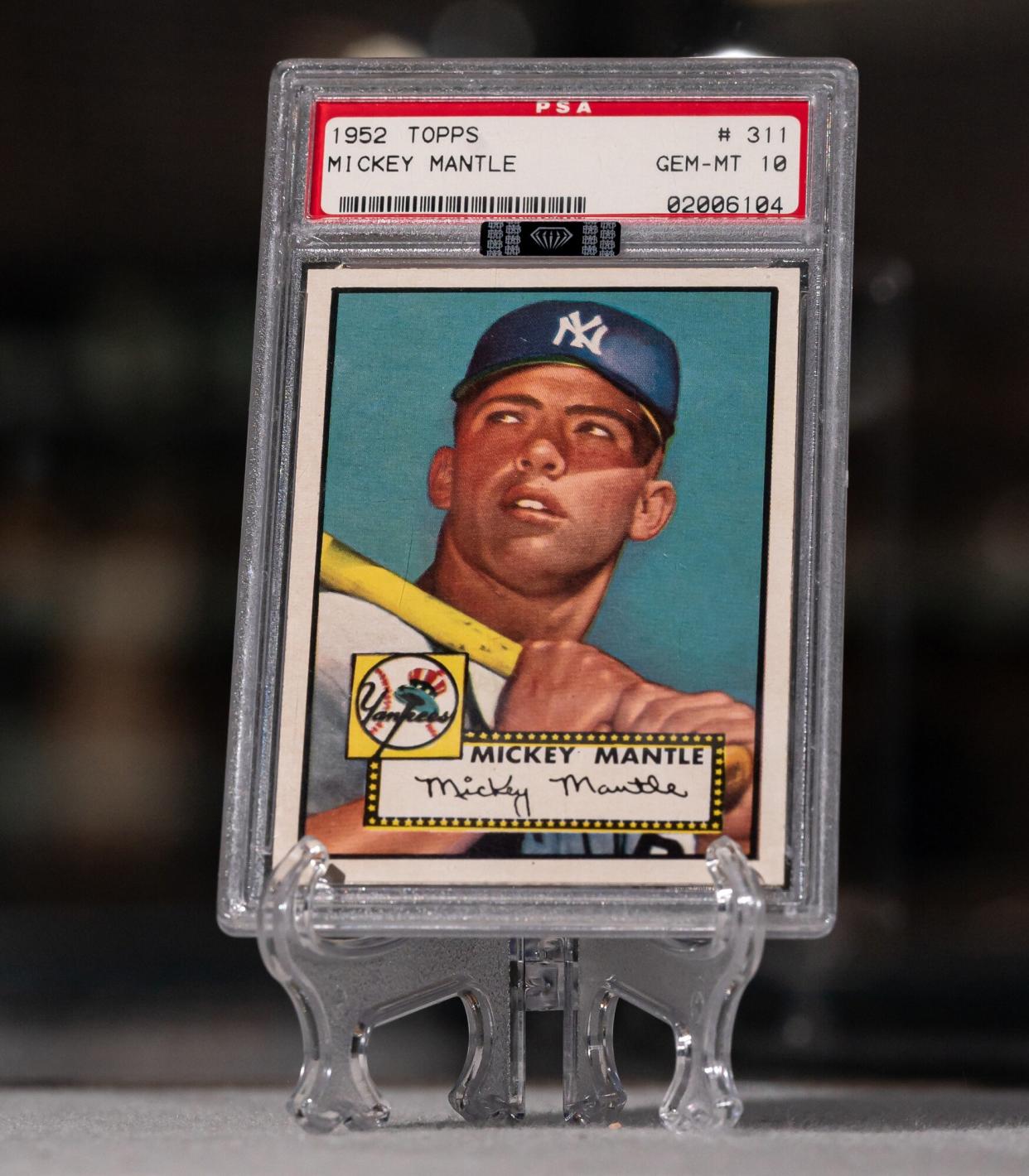 The 1952 Topps Mickey Mantle rookie card from the collection of Marshall Fogel arrives at McGregor Square's Rally Hotel. The card is graded PSA 10 Gem Mint and will be displayed as part of the Major League Baseball All-Star Game's Hall of Legends exhibit in Denver, CO.