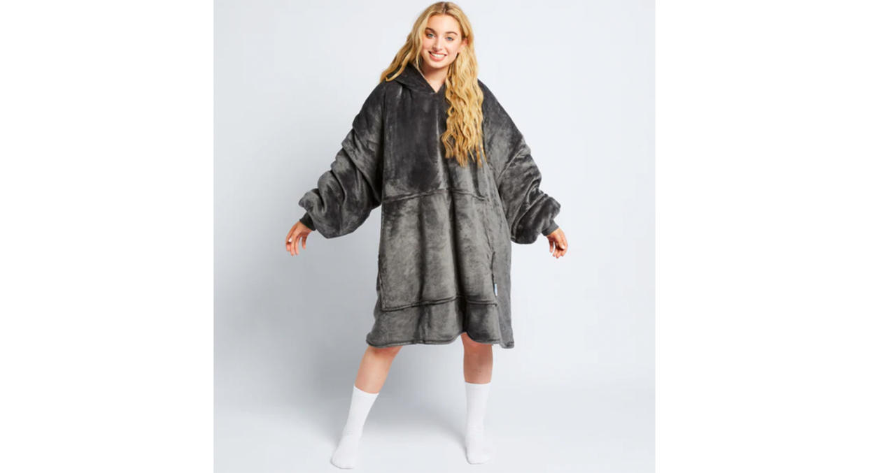 This cosy wearable Oodie blanket is an 6XL and can fit heights of up to 6ft.