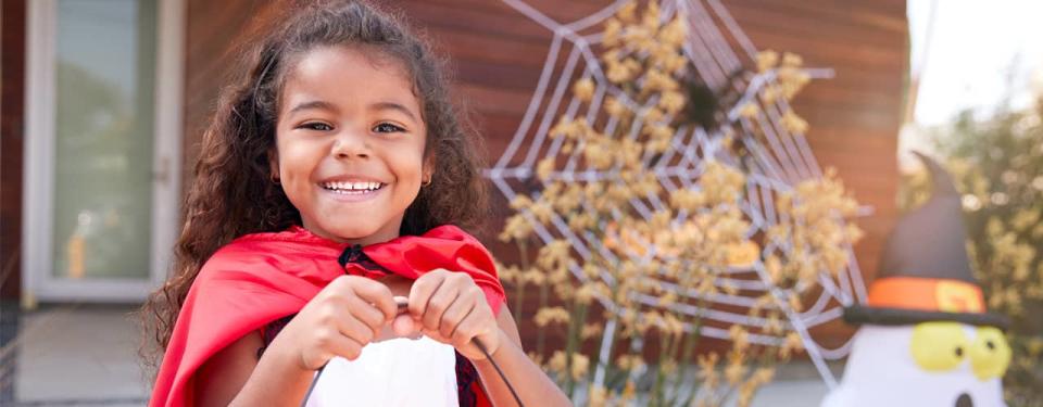 girl dressed up for halloween ready for trick or treating