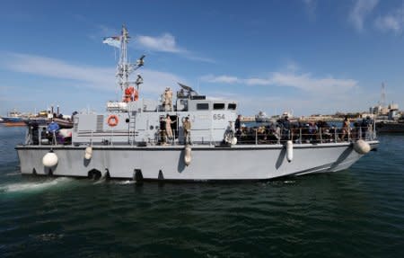 Libyan Navy boat with migrants on board arrives at navy base in Tripoli, Libya November 23, 2017. REUTERS/Ismail Zitouny.