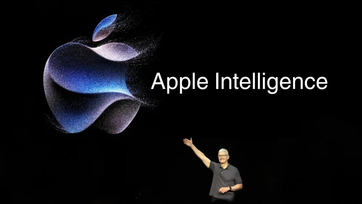  Tim Cook on stage gesturing to an Apple logo beside the phrase "Apple Intelligence". 