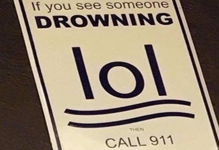 A sign that says "if you see someone drowning then call 911"