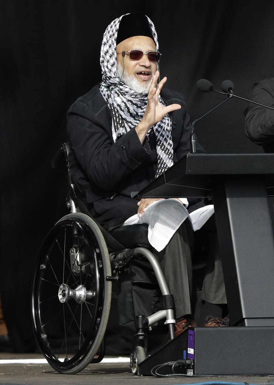 Mosque shooting survivor Farid Ahmed addresses the national remembrance service at Hagley Park for the victims of the March 15 mosques terrorist attack in Christchurch, New Zealand, Friday, March 29, 2019. (AP Photo/Mark Baker)
