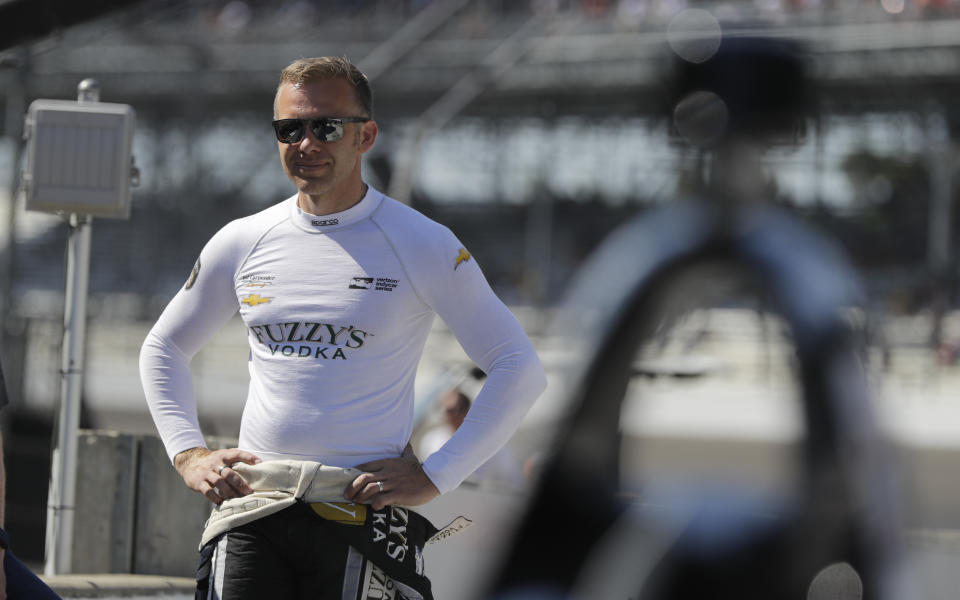 FILE - In this May 25, 2018, file photo, Ed Carpenter waits for the start the final practice session for the IndyCar Indianapolis 500 auto race at Indianapolis Motor Speedway in Indianapolis. Things are starting to feel a little more normal for Ed Carpenter with IndyCar finally about to start its season, though his body clock is still out of sorts. The lone owner-driver in the series surely isn’t alone feeling that way. (AP Photo/Darron Cummings, File)