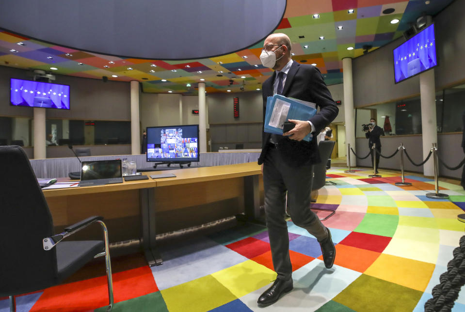 European Council President Charles Michel arrives to take part in an EU Summit, via videoconference link, at the European Council building in Brussels, Thursday, Feb. 25, 2021. European Union leaders are gathering Thursday, via videoconference link, to try to inject new energy into the 27-nation bloc's lagging coronavirus vaccination effort as concern mounts that new variants might spread faster than authorities can adapt. (Olivier Hoslet, Pool via AP)