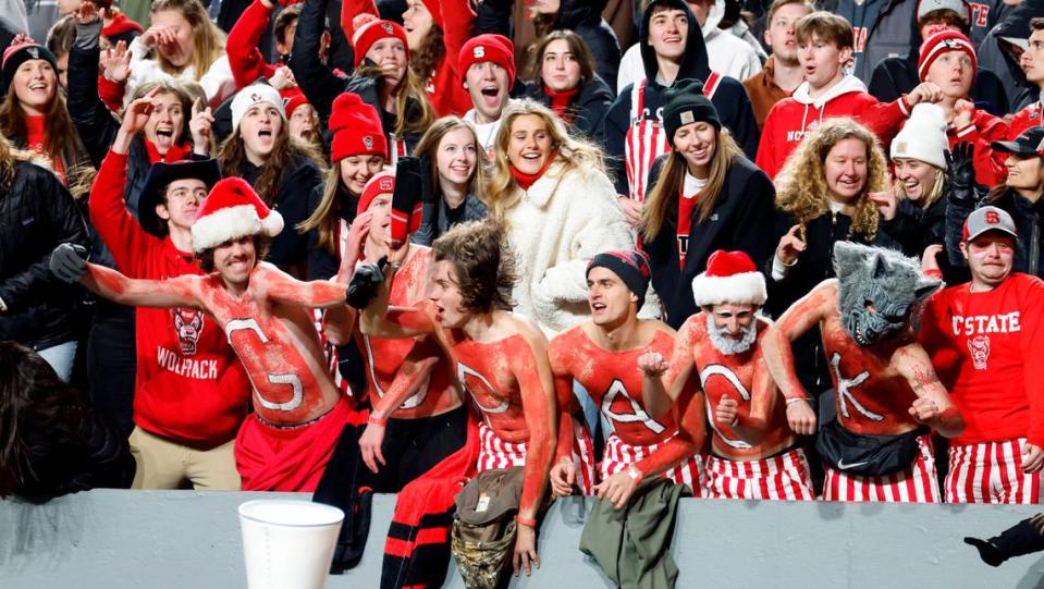 Fans cheer on the Wolfpack during the second half of N.C. State’s 39-20 victory over UNC at Carter-Finley Stadium in Raleigh, N.C., Saturday, Nov. 25, 2023. Ethan Hyman/ehyman@newsobserver.com