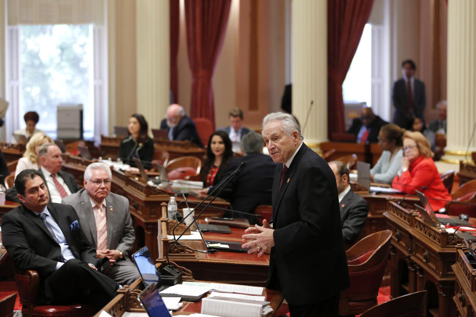 State Sen. Jim Nielsen, R-Gerber, standing center, explains his reasons for not voting against the 2019-2020 state budget in Sacramento, Calif., Thursday, June 13, 2019. Both houses of the Legislature approved the $214.8 billion state budget that spends more on health care and education, bolsters the state's top firefighting agency and boost state reserves.(AP Photo/Rich Pedroncelli)