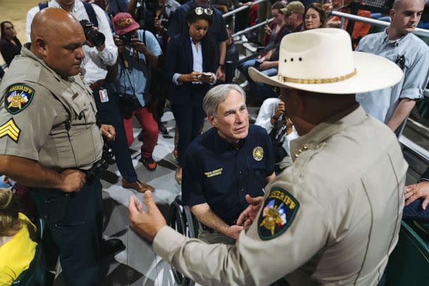 PHOTO: Governor Greg Abbott speaks with sheriffs during a vigil for victims of the Robb Elementary School shooting in Uvalde, Texas, on May 25, 2022.  (Bloomberg via Getty Images, FILE)