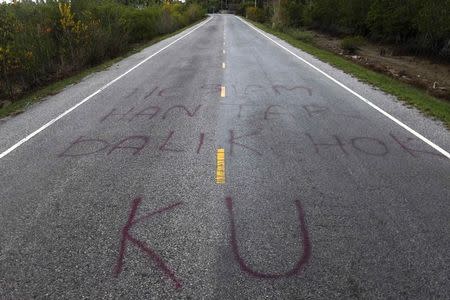 Separatist graffiti is seen on a road near Pattani June 6, 2014, one of three southernmost provinces of Thailand where government troops have fought Muslim insurgents since 2004. REUTERS/Andrew RC Marshall