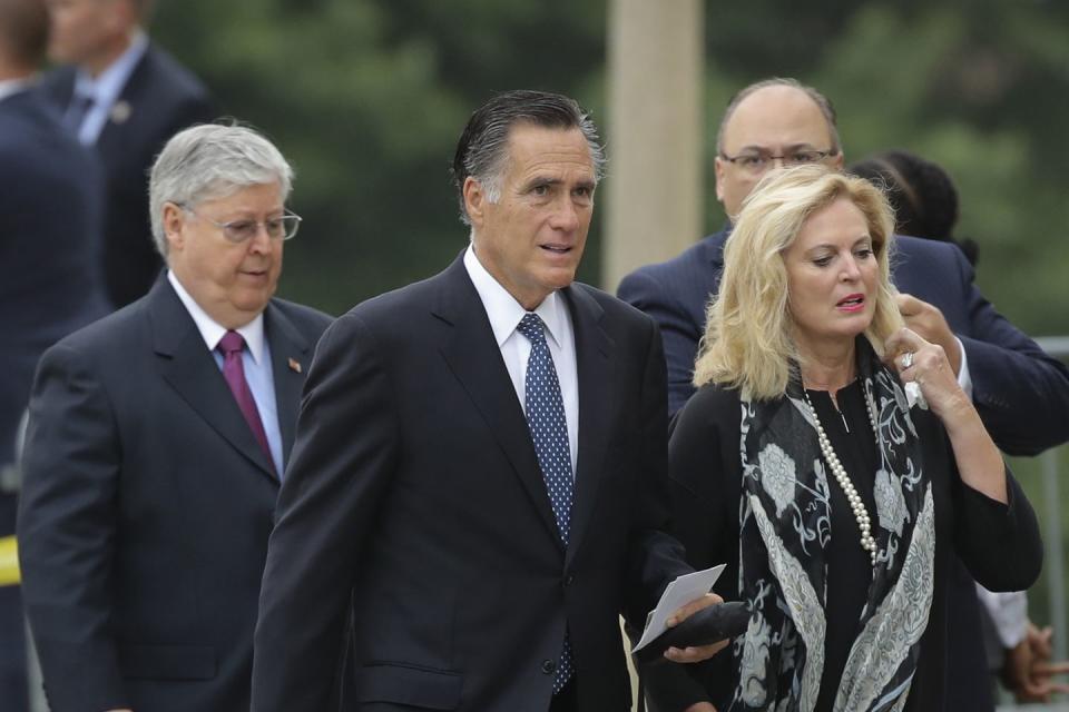 9) U.S. Senate candidate Mitt Romney and his wife Anne arrive at the Washington National Cathedral for the funeral.