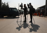 Afghan journalists film at the site of a bombing attack in Kabul, Afghanistan, Tuesday, Feb. 9, 2021. The coordinated killings in Jalalabad on Tuesday, March 2, 2021, of three women working for a local radio and TV station in Jalalabad were the latest in a bloody campaign against journalists in Afghanistan, a country that was already considered one of the most dangerous places in the world to be a journalist. In just the last six months, 15 journalists have been killed in a series of targeted killings. (AP Photo/Rahmat Gul)