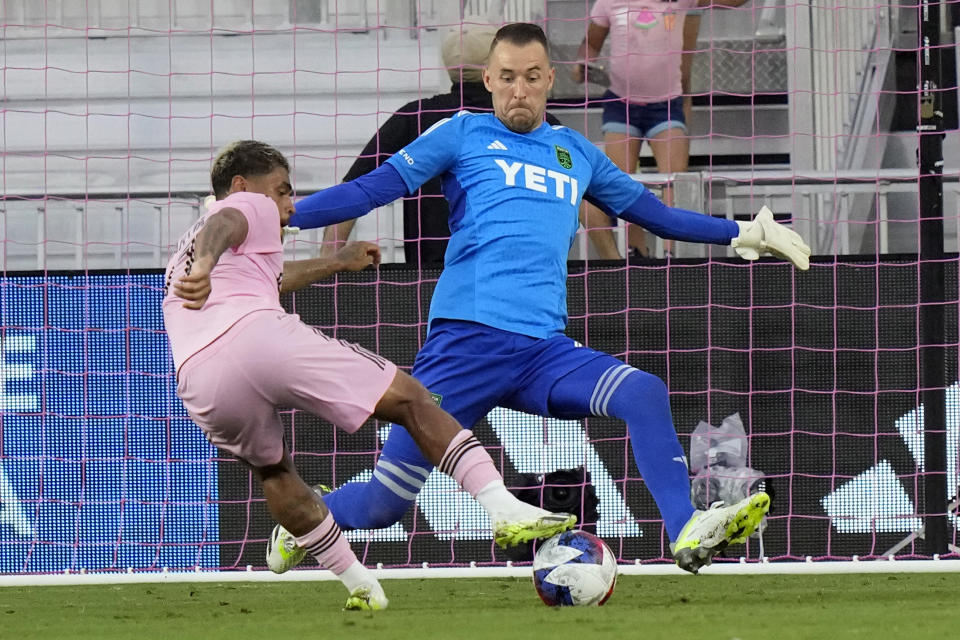 Inter Miami forward Josef Martínez, left, attempts to shoot on goal as Austin FC goalkeeper Brad Stuver, right, defends during the first half of an MLS soccer match, Saturday, July 1, 2023, in Fort Lauderdale, Fla. (AP Photo/Lynne Sladky)