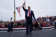 President Donald Trump waves as he arrives for a campaign rally at MBS International Airport, Thursday, Sept. 10, 2020, in Freeland, Mich. (AP Photo/Evan Vucci)