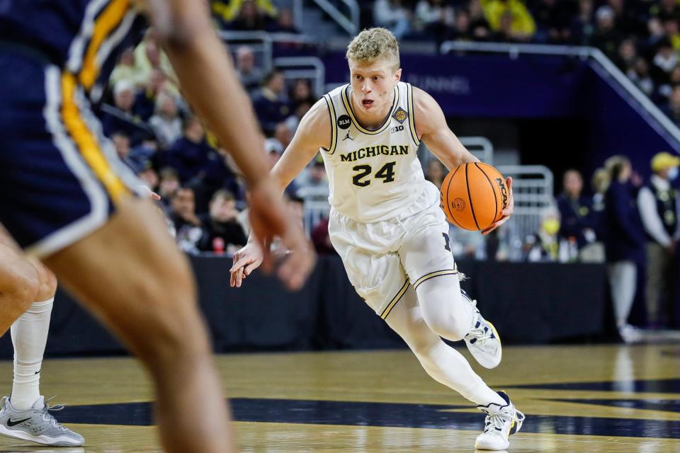 Michigan forward Youssef Khayat (24) dribbles against Toledo during the first half of the first round of the first round of the NIT at Crisler Center in Ann Arbor on Tuesday, March 14, 2023.