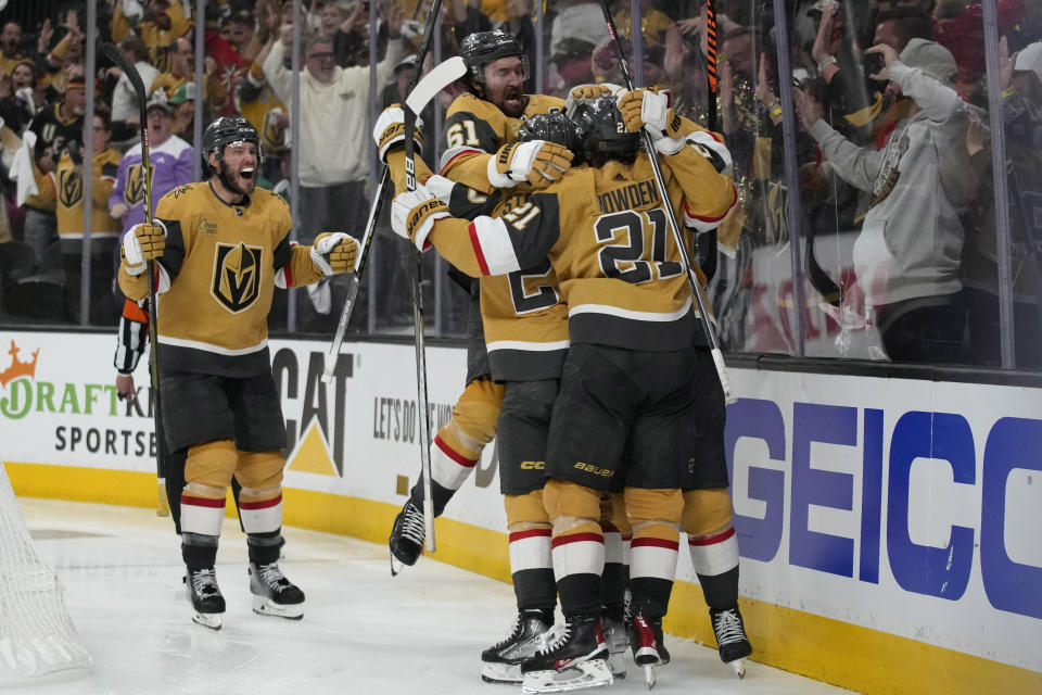 Vegas Golden Knights celebrate after Vegas Golden Knights center Chandler Stephenson (20) scored against the Dallas Stars during overtime of Game 2 of the NHL hockey Stanley Cup Western Conference finals Sunday, May 21, 2023, in Las Vegas. (AP Photo/John Locher)