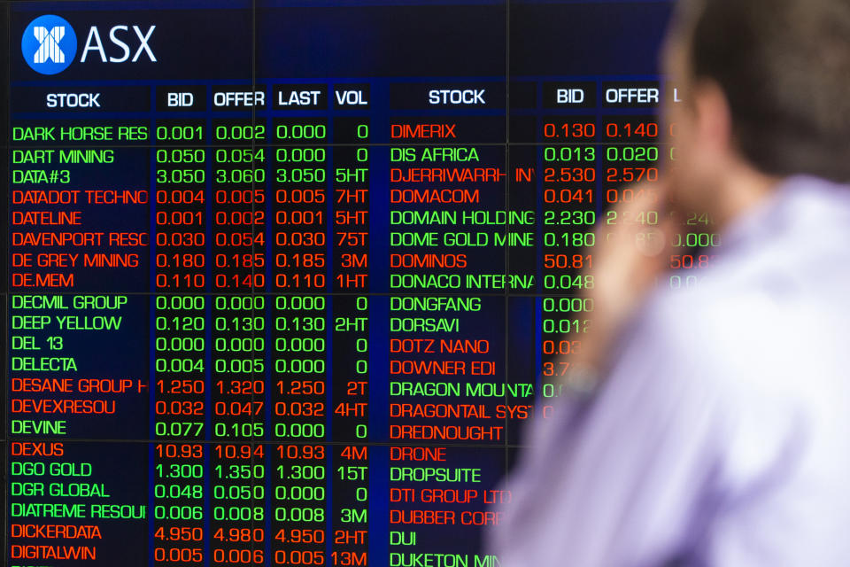 SYDNEY, AUSTRALIA - MARCH 13: A man looks at the electronic display of stocks at the Australian Stock Exchange on March 13, 2020 in Sydney, Australia. The ASX200 plunged more than 7 percent in the first 15 minutes of trade on Friday, amid fears over the spread of COVID-19. The Australian sharemarket fall follows the worst day of trading on Thursday, which saw the worst losses since the Global Financial Crisis. (Photo by Jenny Evans/Getty Images)