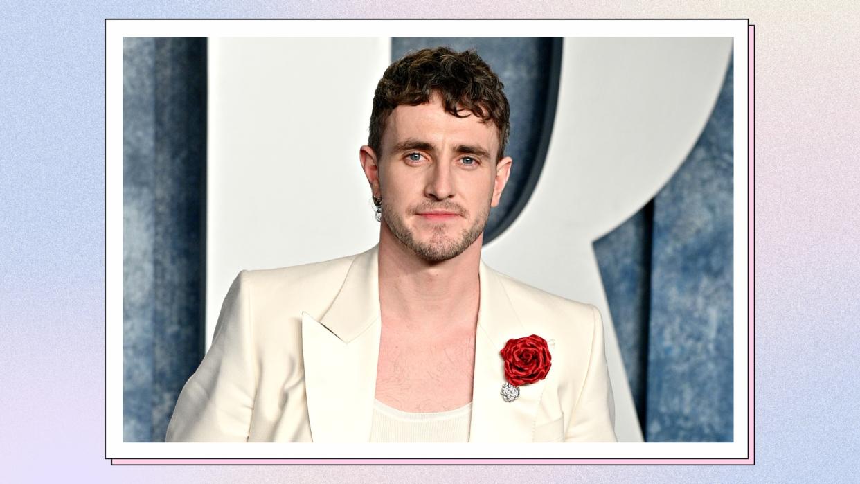  Paul Mescal wears a white suit with a red rose on the lapel, as he attends the 2023 Vanity Fair Oscar Party Hosted By Radhika Jones at Wallis Annenberg Center for the Performing Arts on March 12, 2023 in Beverly Hills, California/ in a blue, cream and purple gradient template 