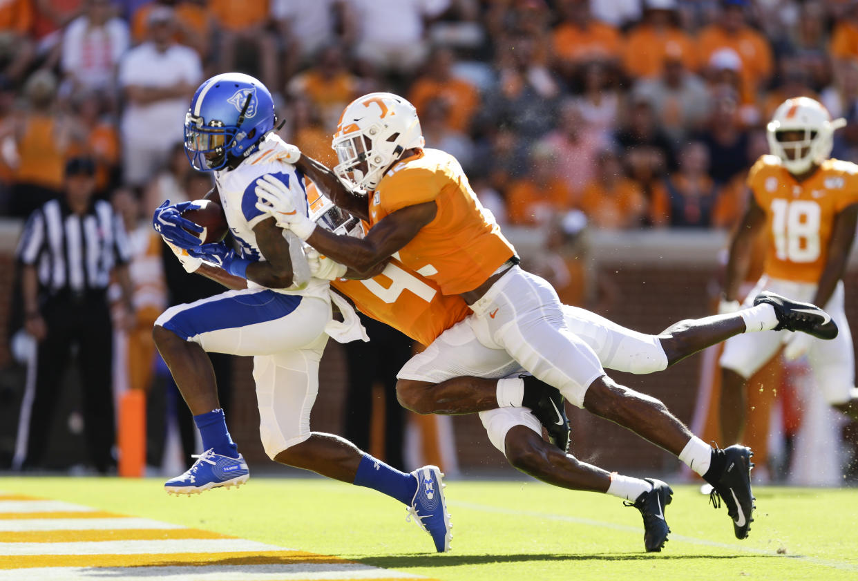 KNOXVILLE, TENNESSEE - AUGUST 31: Cornelius McCoy #83 of the Georgia State Panthers runs into the end-zone to tie the game while defended by Shawn Shamburger #12 and Warren Burrell #4 of the Tennessee Volunteers during the second quarter of the season opener at Neyland Stadium on August 31, 2019 in Knoxville, Tennessee. (Photo by Silas Walker/Getty Images)