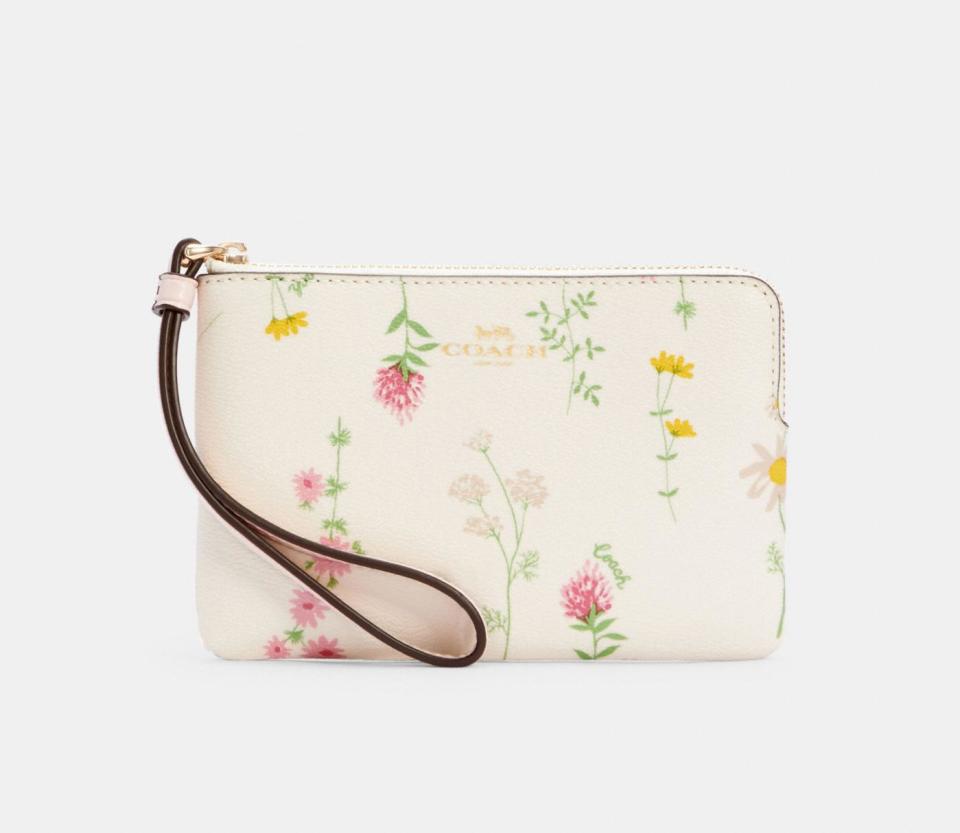 Corner Zip Wristlet With Spaced Wildflower Print. Image via Coach Outlet.