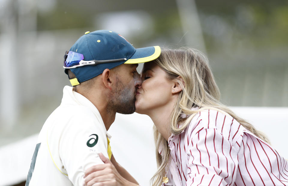 Nathan Lyon, pictured here sharing a kiss with Emma McCarthy during the Ashes in 2019.