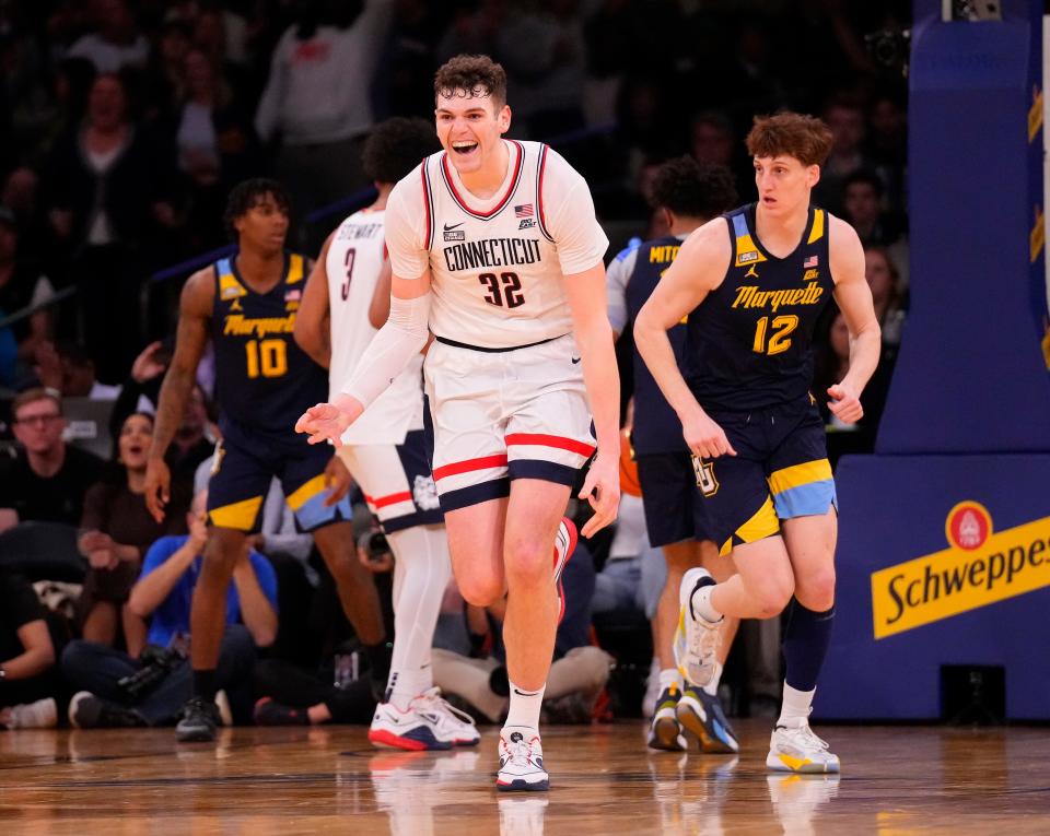 Mar 16, 2024; New York City, NY, USA; Connecticut Huskies center Donovan Clingan (32) after a big basket in the second half at Madison Square Garden. Mandatory Credit: Robert Deutsch-USA TODAY Sports