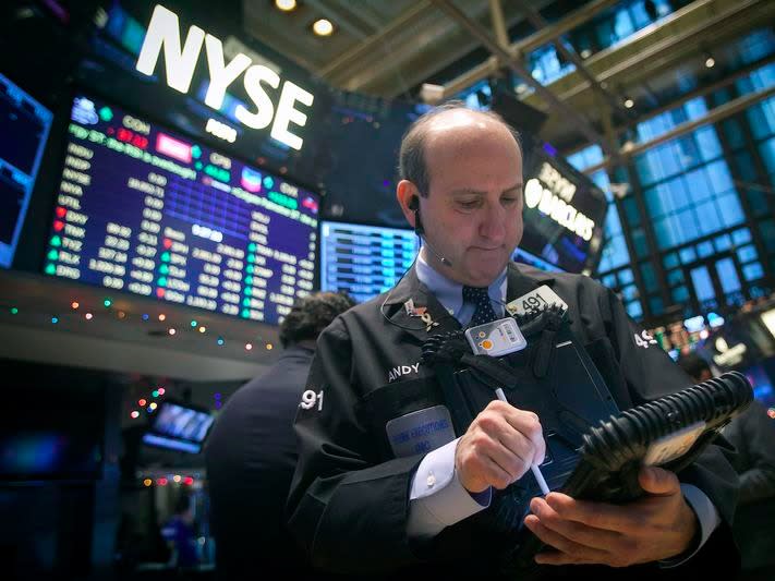 Traders work on the floor of the New York Stock Exchange (NYSE) in New York December 29, 2014.   REUTERS/Carlo Allegri  