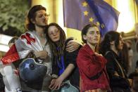 Demonstrators attend a rally outside the parliament building in Tbilisi, Georgia, on Wednesday, April 17, 2024, to protest against "the Russian law" similar to a law that Russia uses to stigmatize independent news media and organizations seen as being at odds with the Kremlin. (AP Photo/Zurab Tsertsvadze)