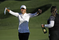 Danielle Kang gives socially distanced hugs to fans and supporters after winning the LPGA Drive On Championship golf tournament Sunday, Aug. 2, 2020, at Inverness Golf Club in Toledo, Ohio. (AP Photo/Gene J. Puskar)