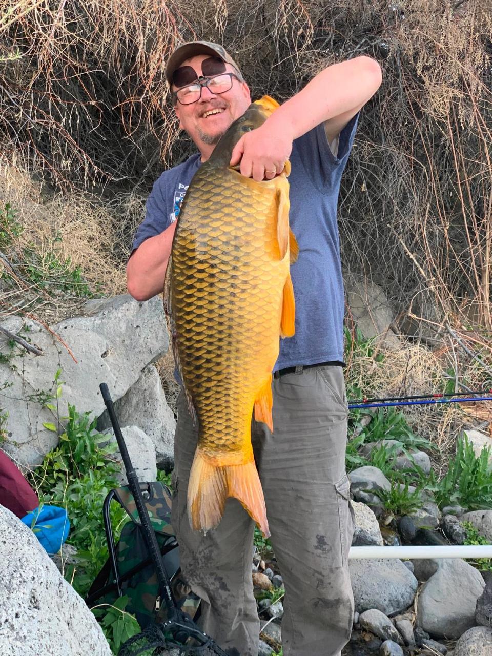 Henry Charlier, of Boise, poses with the record 34-pound common carp he caught on the Snake River on May 3.