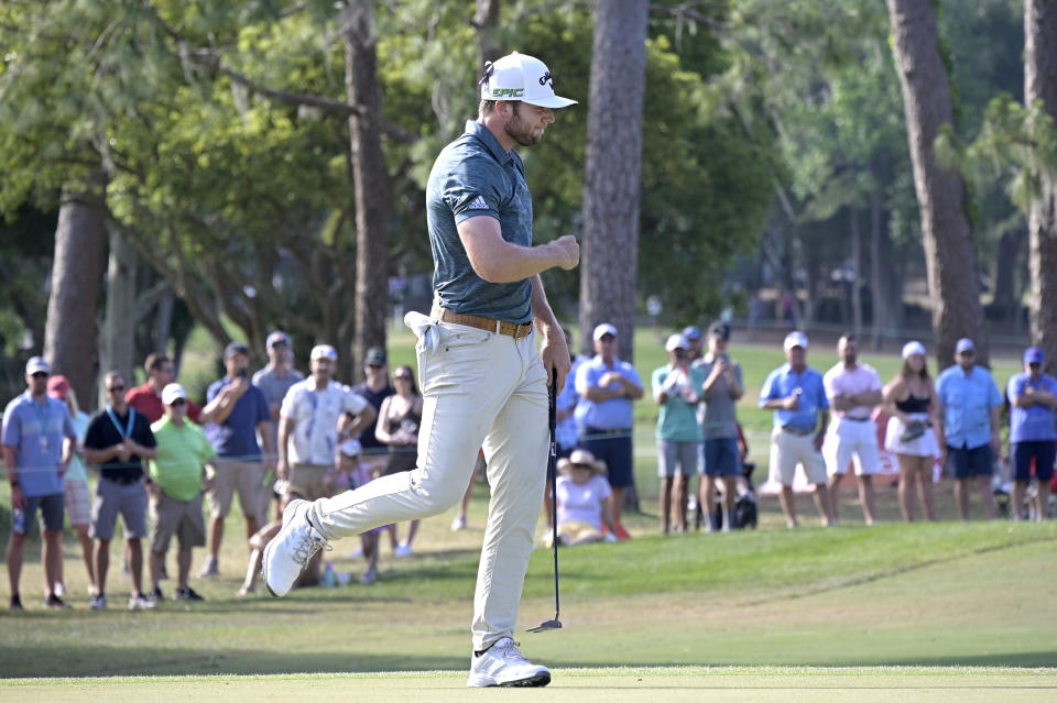 FILE - Sam Burns celebrates after sinking a putt for birdie on the 16th green during the final round of the Valspar Championship golf tournament, Sunday, May 2, 2021, in Palm Harbor, Fla. His 7-iron into the hole was key in helping him win for the first time on the PGA Tour. (AP Photo/Phelan M. Ebenhack, File)