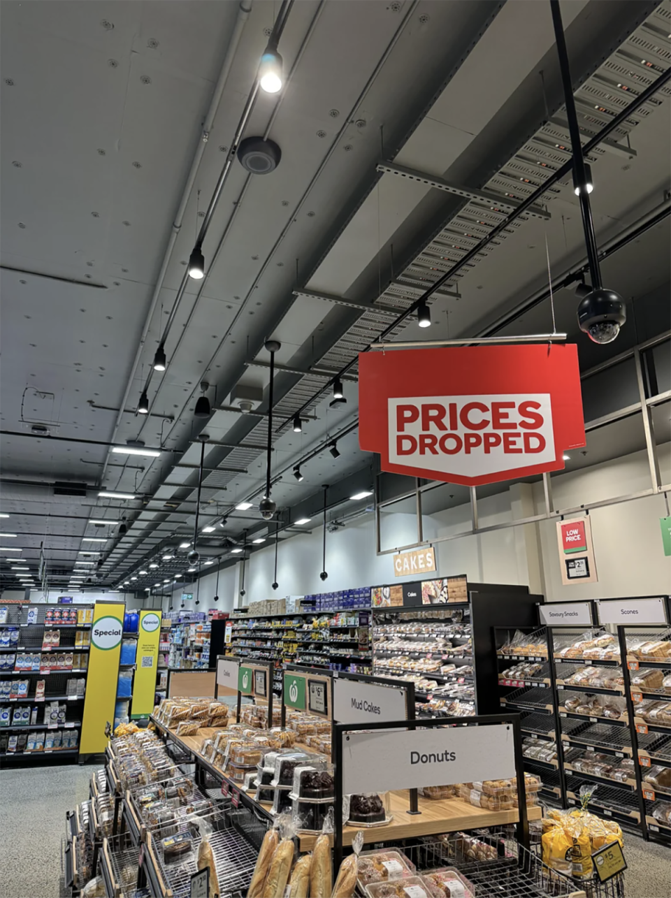 The CCTV cameras hanging from the ceiling inside the Woolworths store. 