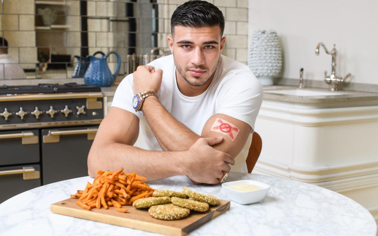 Love Island's Tommy Fury unveils the new patch designed by plant-based food company Strong Roots and Professor Charles Spence to help people curb their meat cravings when trying to adopt a more plant-based diet - PA