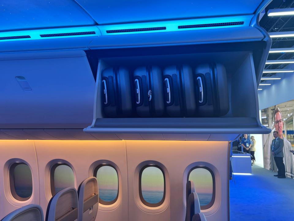 Suitcases in the luggage bins in a Boeing 777X cabin mockup