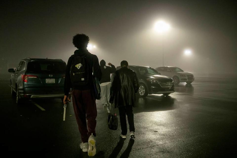 Jarin Stevenson walks with his family to their car on a foggy night, following Seaforth High School’s victory over Jordan-Matthews on January 31, 2023 at Seaforth High School in Pittsboro, N.C.