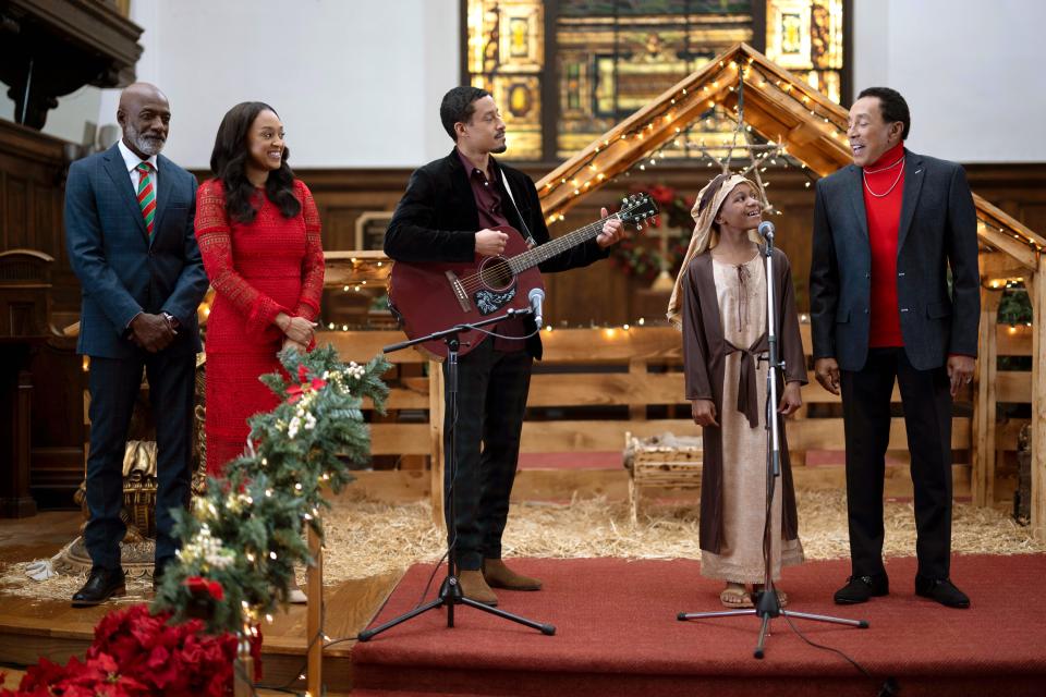 From left: Rothaford Gray, Tia Mowry-Hardrict, Mark Taylor, Markeda McKay and Smokey Robinson in Lifetime's "Miracle in Motor City."