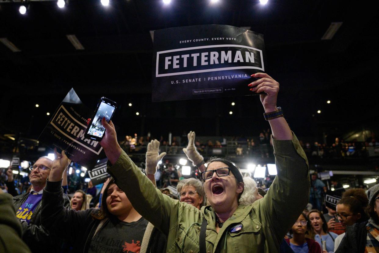 Supporters watch live results on screen during a watch party election night event for Pennsylvania Democratic Senatorial candidate John Fetterman during the midterm election at Stage AE in Pittsburgh, Pennsylvania, on November 8, 2022.