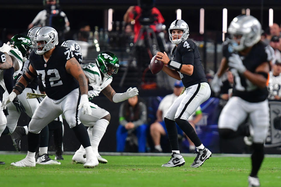 Nov 12, 2023; Paradise, Nevada, USA; Las Vegas Raiders quarterback Aidan O'Connell (4) drops back to pass against the New York Jets during the first half at Allegiant Stadium. Mandatory Credit: Gary A. Vasquez-USA TODAY Sports