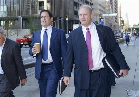 Mark Cuban (L), the billionaire owner of the NBA's Dallas Mavericks, and his attorney Stephen Best (R) approach U.S District Court for the opening day of his insider trading trial in Dallas, Texas September 30, 2013. REUTERS/Tim Sharp