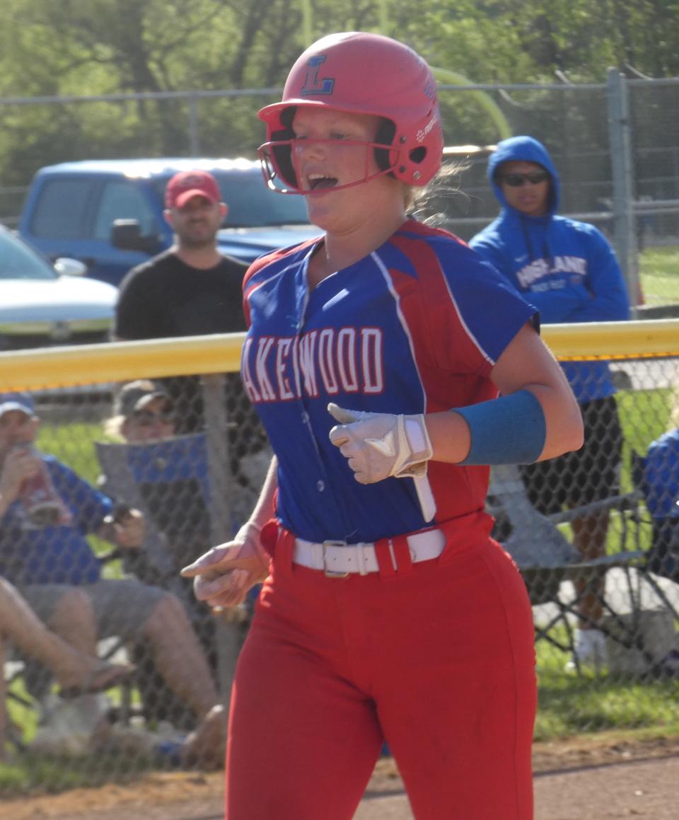 Lakewood senior Ashley Poling celebrates a home run against Highland during a Division II district semifinal at Olentangy on Monday, May 16, 2022. The Lancers won 8-2 to set up a district final rematch with Jonathan Alder.