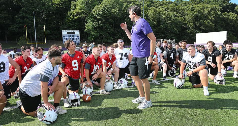 New Curry College football coach Todd Parsons addresses his players after practice on Friday, Aug. 12, 2022.