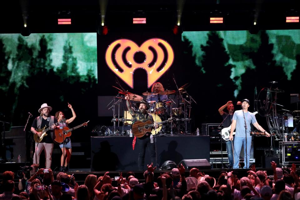 Coy Bowles, Caroline Jones, Zac Brown, Chris Fryar and Jimmy De Martini of the Zac Brown Band perform during the 2022 iHeartCountry Festival in Austin, Texas.