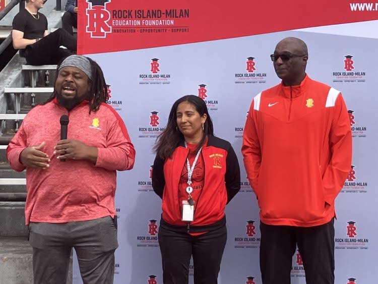 Eddie Williams (left), head coach of the school girls’ track & field, speaks at the Monday afternoon presentation.