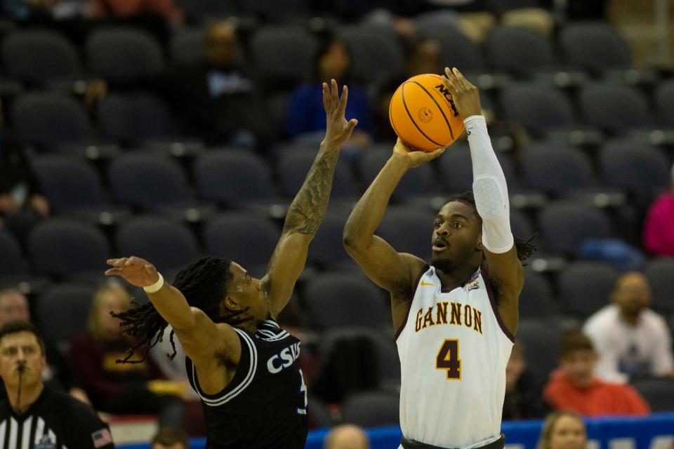 Gannon’s Josh Omojafo (4) takes a shot as the Gannon Golden Knights play the California State University San Bernardino Coyotes during the quarterfinal round of the NCAA Division II Men's Basketball championship at Ford Center in Evansville, Ind., Tuesday.